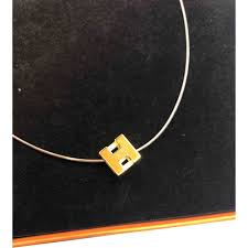 A swirly initial necklace in heavy 14k yellow gold with free 18 inch cable chain. Cage D H Necklace Hermes Gold In Metal 7976993