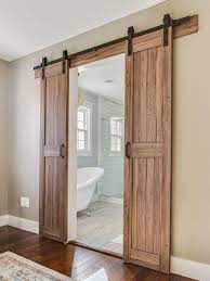 Improve your home with wayfair! Barn Doors Leading Into Master Bathroom In A Modern Farmhouse Barn Style Sliding Doors Farmhouse Interior Doors Farmhouse Doors