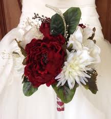 Photo by red boat photography and bouquet by designer buds. Red Rose Winter Bridal Bouquet
