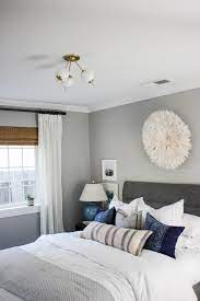 A commanding ceiling light fixture supplies more than just overhead light in a small bedroom. Small Home Style How To Choose Lighting For A Small Bedroom Katrina Blair Interior Design Small Home Style Modern Livingkatrina Blair