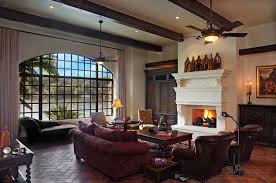 Its design offers the impact of a chandelier fixture and the cooling feature of a ceiling fan in one unit. Exquisite Mediterranean Style Residence On Lake Austin Texas Rustic Living Room Farm House Living Room Living Room Ceiling Fan