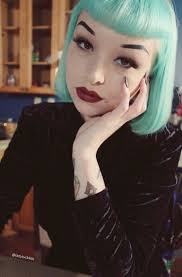 Love the hair color + bangs + lipstick + tattoos