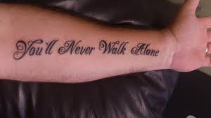 Why do liverpool fans sing 'you'll never walk alone'? Y N W A You Ll Never Walk Alone Tattoo Alone Tattoo Liverpool Tattoo Tattoos