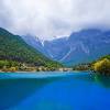 Its highest peak is named shanzidou ( 扇子陡) and is 5,596 m (18,360 ft) above sea level. 1