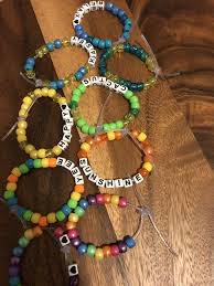 Pony bead key chains are simple to make and can be an excellent project for summer camp craft time. Pony Bead Bracelets Pony Bead Bracelets Plastic Bead Crafts Beaded Bracelets Diy