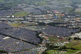 Well It Wouldn T Be Glastonbury Without It Revellers Reach For Ponchos As Showers Hit Festival But Don T Worry Sun Is On The Way Glastonbury Aerial View Glastonbury 2013
