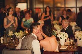 He started in music photography, photographing the bands he loved. Bride And Groom Entrance And Kiss Taylor Jackson Photography The Bauer Kitchen Wedding Venue Restau Taylor Jackson Wedding Poses Natural Wedding Photography