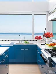 Boho, block color, minimalist, chic patterns, hearts, plaid and more. A Modern Blue Kitchen That Maximizes Every Inch Blue Kitchens Sleek Kitchen Kitchen Design