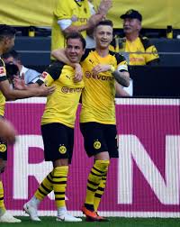 Dortmund S German Midfielder Mario Goetze And Dortmund S German Forward Marco Reus R Celebrate The 3 2 Against Augsburg D Borussia Dortmund Dortmund Augsburg