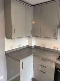 Natural wood cabinets are usually a light wood, like pine or oak, and left unstained or relatively unfinished. Maidment Properties On Twitter Kitchen Completed For A Client In West End Southampton The Kitchen Is Howdens Greenwich In Gloss Dove Grey With Light Stone Worktop Upstand And White Gloss Backboard