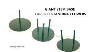 When you have attached all of your petals, continue wrapping floral tape down the wire to finish off the stem. Large Paper Flowers Giant Stem Base Giant Paper Flower Stand Tutorial Giant Paper Flower Stems Youtube