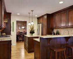 Rich Dark Cabinets W Blonde Hardwood Floors And Granite Countertops Home Remodel Stained Kitchen Cabinets Cherry Cabinets Kitchen Dark Wood Kitchen Cabinets