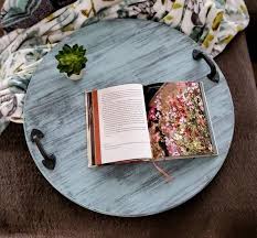 Use your ottoman for more than just a seat or foot rest. Rustic Wooden Serving Tray Round Tray Decorative Tray Rustic Home Decor Ottoman Tray Circular Wooden Serving Tray Home Decorations In 2020 Wooden Serving Trays Ottoman Tray Round Coffee Table Decor