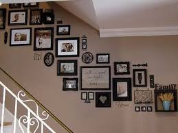Hanging art or photos on the walls can make a house feel more like a home, personalizing your space. Put Some Family Photos On Your Walls Staircase Wall Staircase Pictures Staircase