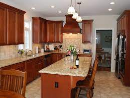 The quartz countertop top adds a dose of luxurious feel to the cozy atmosphere created by the white and wood combination. Granite Countertop Colors Hgtv