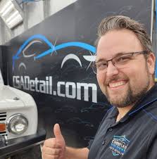 Who can recommend a car detailer to fix sticky car seats?