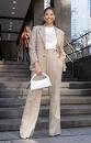 Natalia Bryant cuts a smart figure as she dons an oatmeal ...