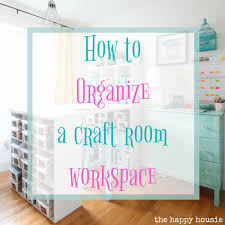 Photographs, postcards, and other inspiring bits of ephemera remain in view, tucked under the straps. How To Organize A Craft Room Work Space The Happy Housie