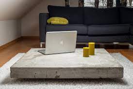 Poor the concrete to about 3/4 of the mold, and then vibrate all the air bubbles out, after vibrating you can put in the reinforcement bars. Concrete Coffee Tables You Can Buy Or Build Yourself