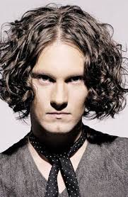 You can carry this hairstyle with all kinds of looks. Man Medium Long Curly Hairstyle With Long Side Bangs In Dark Brown Hair Color Jpg