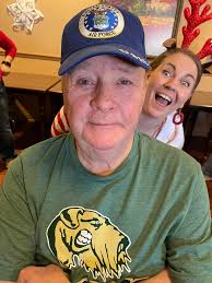 Santa and the Grinch are in the area blasting Christmas music