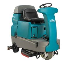 Vacuuming floor at home using vacuum cleaner. Floor Cleaning Machines Tennant Company