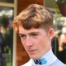 Joe Leavy, a 20-year-old apprentice from Wiltshire, has emerged as a  standout in British Flat racing, blending resilience with remarkable  talent. Born around 2005, the son of former trainer Barry Leavy, he