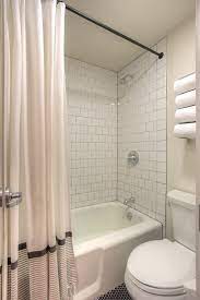 Hotel Durant White 4x4 Tile With Gray Grout Black Powdered Coated Rod Iron Shower White Bathroom Tiles Modern Bathroom Design Marble White Tile Backsplash