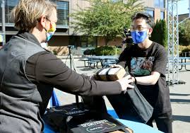 Students Pickup 250 Laptops for New Year