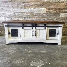 Made from pine wood and hand painted to create a piece that is entirely unique as functional. Barn Door Coffee Table White Brown Top Rustic Rarehouse