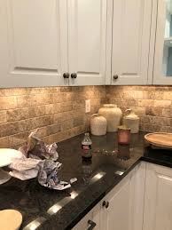 A neutral backsplash is made up of beige, tan, black, white or gray tones. New Lake House Kitchen Makeover Phase 1 Painted Tile Backsplash Styled With Lace