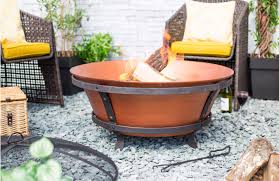 Striking cast iron fire pits for outside heat and ambiance. Brushed Copper Cast Iron Fire Pit