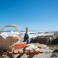 At Namaqua Flower Beach Camp Guests Can Enjoy Their Winewednesday Right On The Beach In Groenrivier Click Beach Camping Lake George Camping Beaches Near Me