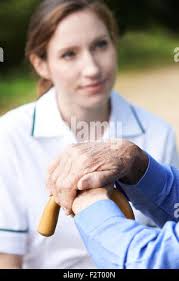 Elderly man with cane walking up a lane leading to a farm in central  Virginia in early September Stock Photo