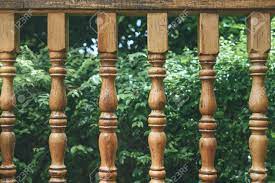 Square wooden balusters 10 pack (poplar) 1 1/4x 36 5061. Wooden Railing On Porch Overlooking Garden With Green Trees Stock Photo Picture And Royalty Free Image Image 154460076