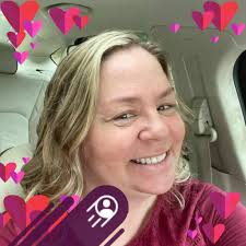 Grab a dollar tree decoration a couple of mop heads to make this ghost wall  decor