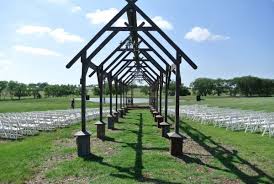 The bluebonnet barn, a classic red barn surrounded by beautiful gardens; Jones Barn Cleburne Texas Wedding Venue