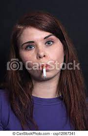 Beautiful Brunette Smokes A Cigarette 9 A Lovely Young Brunette Smokes A Cigarette Canstock