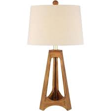 I believe it's because of its simple elegance. 360 Lighting Mid Century Modern Table Lamp Tripod Wood Off White Oatmeal Drum Shade For Living Room Bedroom Bedside Nightstand Target
