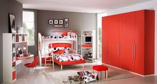This red bedroom has a touch of asian style with graphic prints on the bed and dresser, and simple, clean lines. Bedroom Kids Bedroom Best Red Color Pictures Of Boys Bedroom Wall Designs Cool Decoration Pictures Of Boys Be Red Bedroom Walls Bedroom Red Girls Bedroom Paint