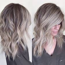 Adding bangs to long locks creates a trendy, flattering hairstyle. 35 Charismatic Light And Dark Ash Blonde Hairstyles 2021