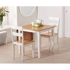 If you want a kitchen table but don't have space for a large rectangular or square design, go for a smaller round bistro one instead. Beckville Folding Dining Set With 2 Chairs Beachcrest Home Colour Table Base White Small Kitchen Tables Small Dining Table Space Saving Dining Table