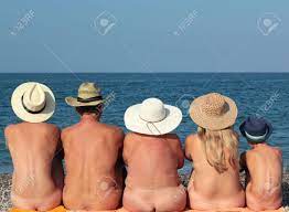 Naked family in the beach
