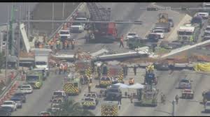 Crushed vehicles lie under a section of a collapsed pedestrian bridge near florida international university, march 16, 2018, near sweetwater, fla. Several Dead In Bridge Collapse At Florida International University