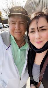 Hello everyone! This is my dad, I lost him to cancer in 2011. Was wondering  if someone could remove the lady and the glare from his face, please? 🙏🏻  Hosting thanksgiving was