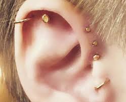 Lulu's body piercing must insist that for your safety and the protection of those around you, do not attempt any of the piercings or stunts you're about to see. The Triple Forward Helix Single Helix And Tragus Piercing 13 Unique Ear Piercing Popbuzz