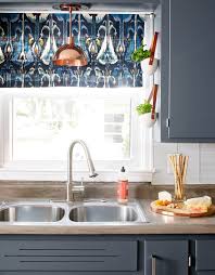 The best cabinet cleaner for greasy cabinets is to use a solution made of equal parts water and white vinegar. How To Clean Kitchen Cabinets Including Those Tough Grease Stains Better Homes Gardens