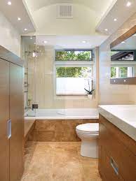 The shower disappears in the background thanks to continuous flooring and wall tile throughout the room. European Bathroom Design Ideas Country Bathroom Designs European Bathroom Design Bathroom Lighting Design