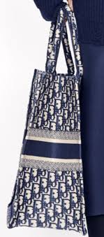 How To Spot A Fake Dior Book Tote Bag Brands Blogger Beige and maroon toile de jouy embroidered canvas christian dior book tote with dual rolled top handles, embroidered logo at front, tonal canvas interior and open top. how to spot a fake dior book tote bag