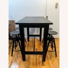 For tighter spaces—perhaps off in the corner or adjacent to a kitchen counter—there's the sleek, modern curves of the circular docksta pub table. Ikea Modern High Top Dining Table Set Aptdeco